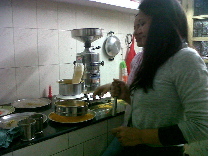 Grinding fresh turmeric at home.