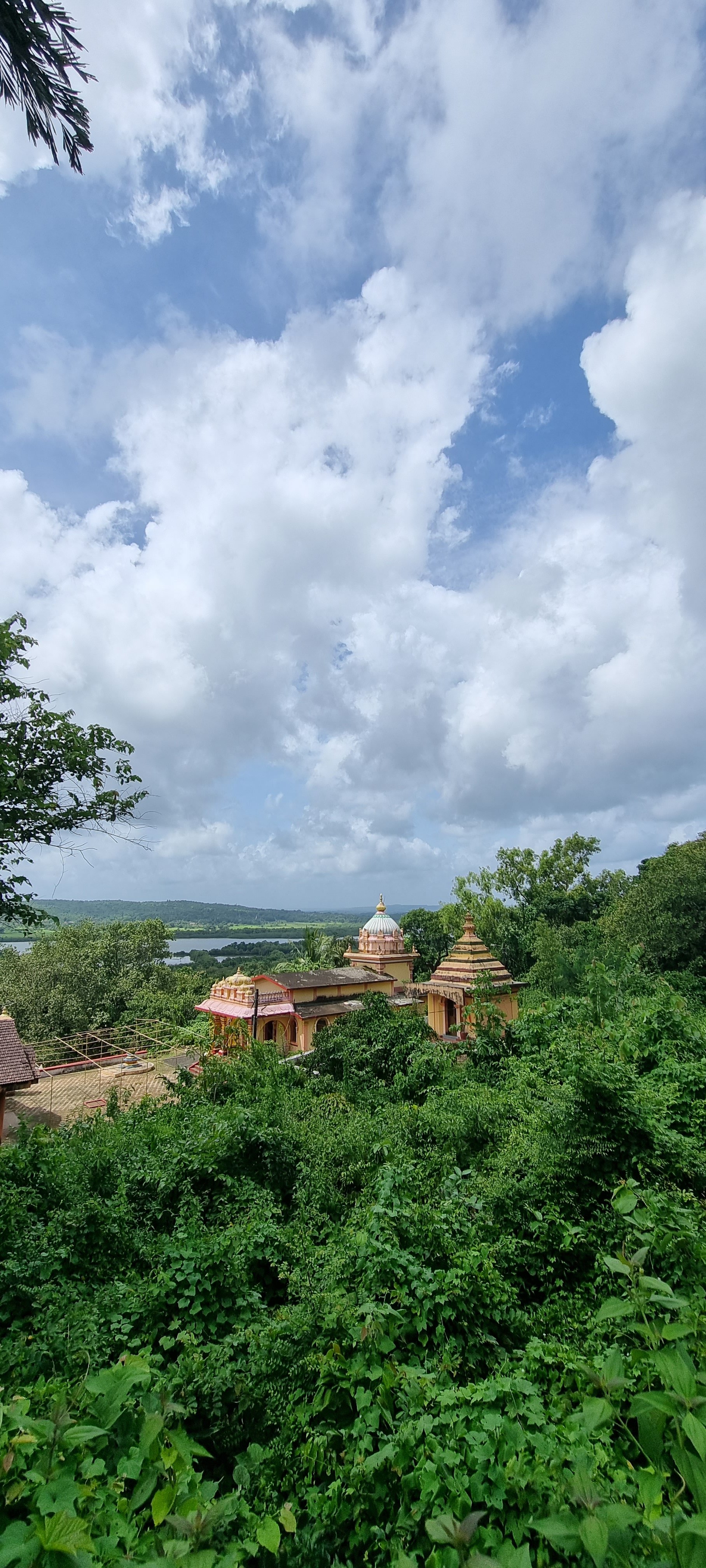 Hindu temple from the hillock of Our Lady of Piety Church. you can see the Mandovi in the distance. Note the unique temple design.